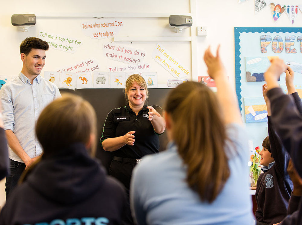 classroom of students undertaking a first aid course