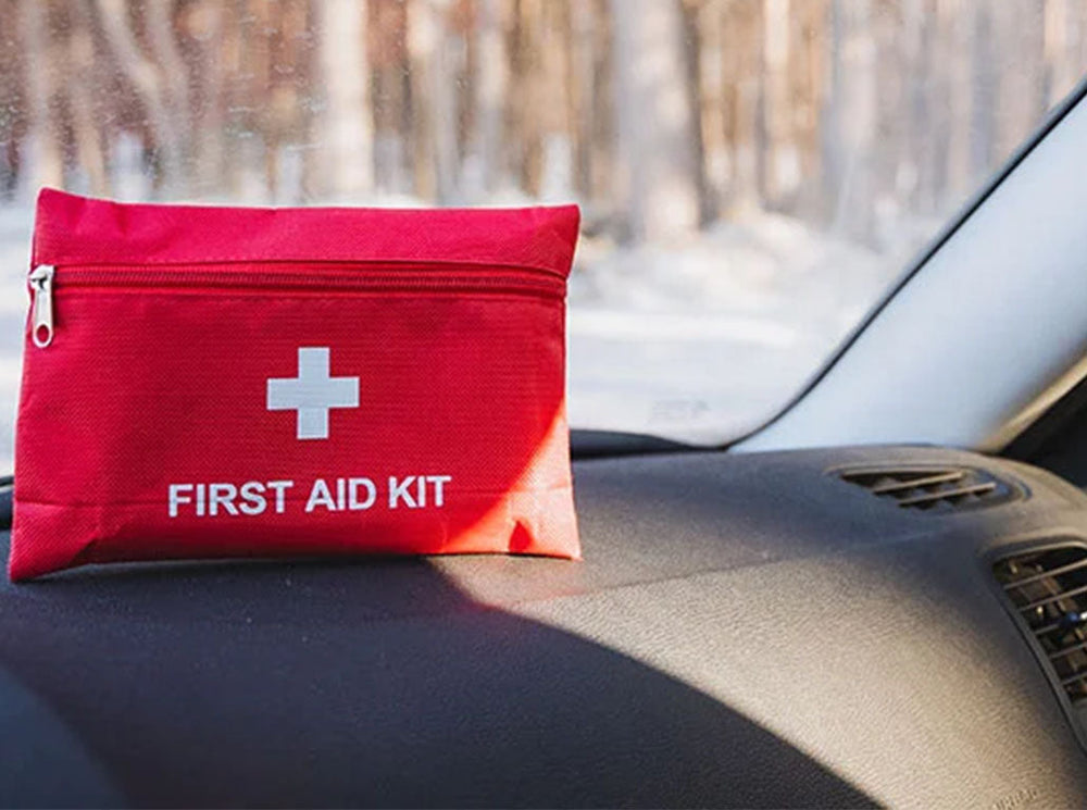 first aid kit on a car dashboard