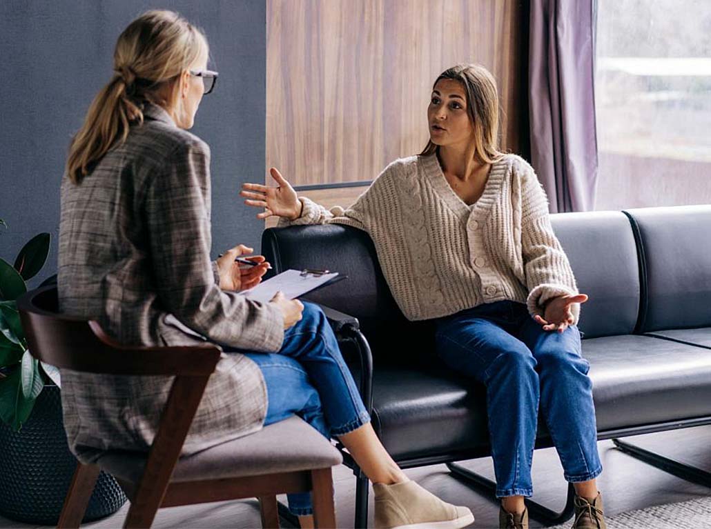 two women talking in a therapy session