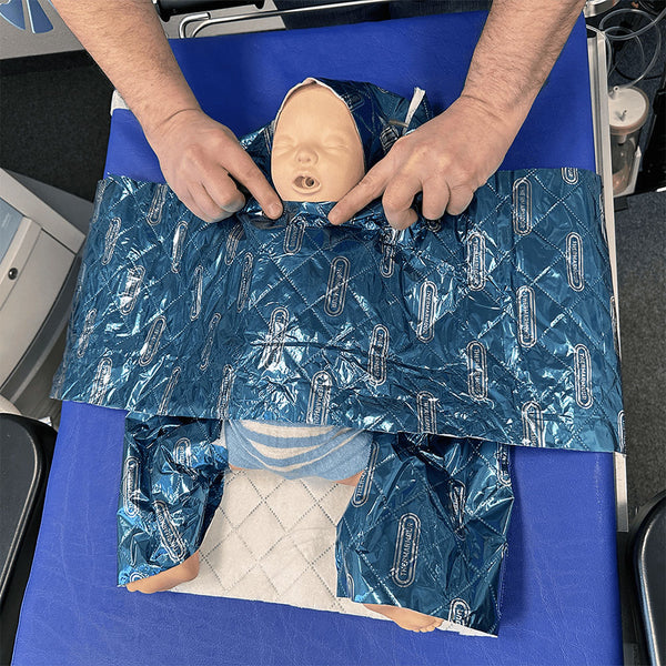 A practical demonstration of applying the THERMARMOUR Baby Wrap.