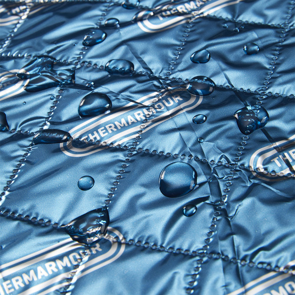 A close-up of the THERMARMOUR Baby Wrap, with water droplets on it.