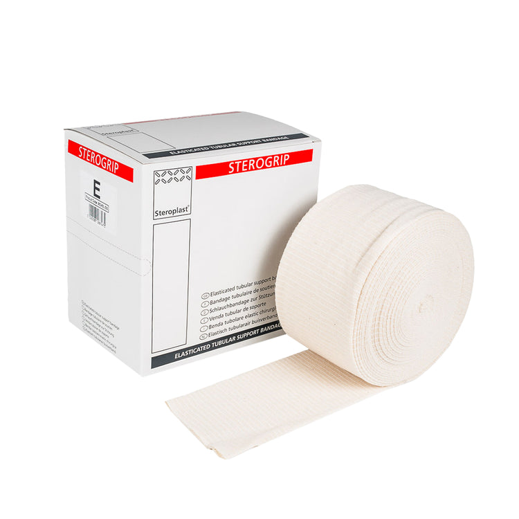 Sterogrip elasticated tubular support bandage roll displayed beside Steroplast packaging