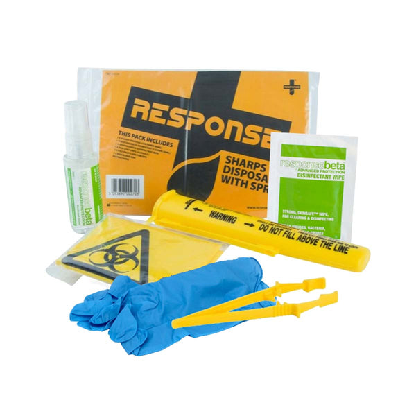 Sharps disposal kit displayed on a white background, including a yellow sharps container with safety warnings, blue disposable gloves, yellow plastic tweezers, a biohazard bag, disinfectant wipes, a protective pack labelled “Response,” and a small bottle of sanitising spray.