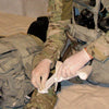 A demonstration of applying the TacMed 4 inch Olaes Modular Banage.