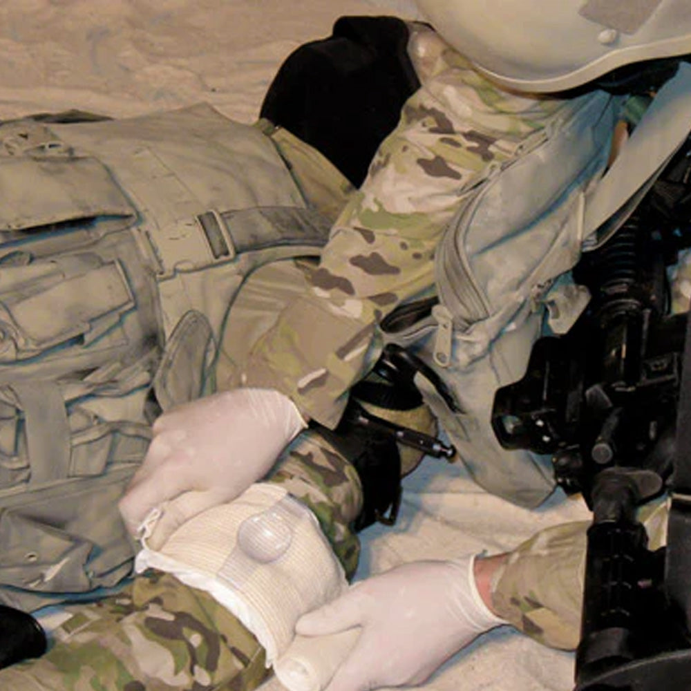 A demonstration of an applied TacMed Olaes 4 inch Modular Bandage.