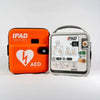 IPAD AED device with orange carrying case on a white background