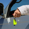 A woman holding a ResQMe 2-in-1 Rescue Tool in one hand, by the keychain hole.