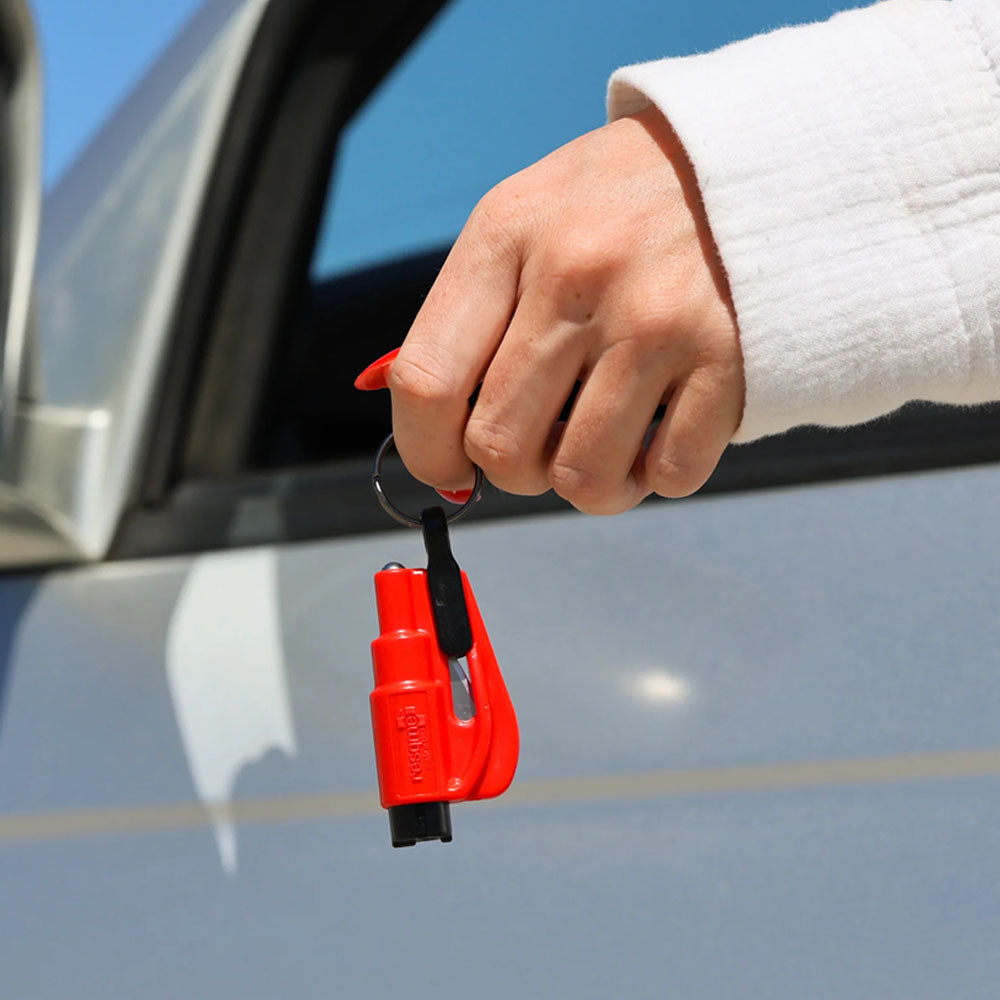 A close-up of a woman holding her ResQMe 2-in-1 Rescue Tool.