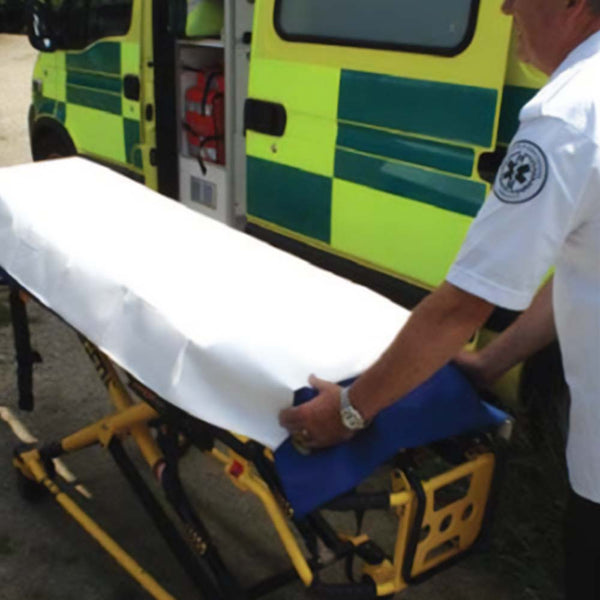 The Mediwrap Barrier Stretcher Sheet on a stretcher.
