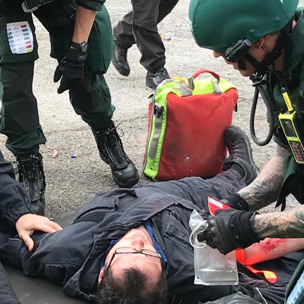 A first aid and specialist trauma course, with paramedics responding to a casualty.