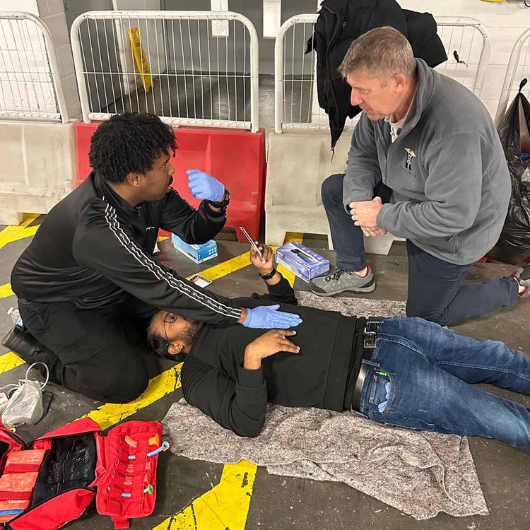A first aid and specialist trauma course, with learners at an industrial site.