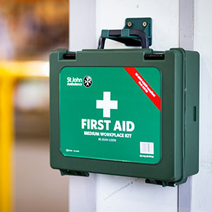 Green first aid kit with St John Ambulance logo on a white background